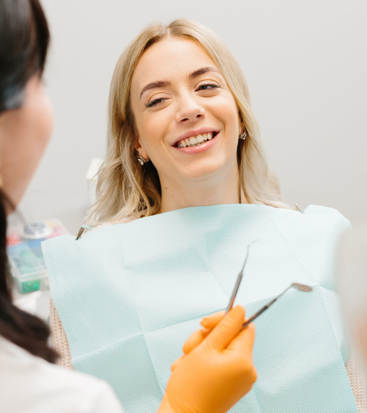 Doctor talking with her patient. Dentist concept