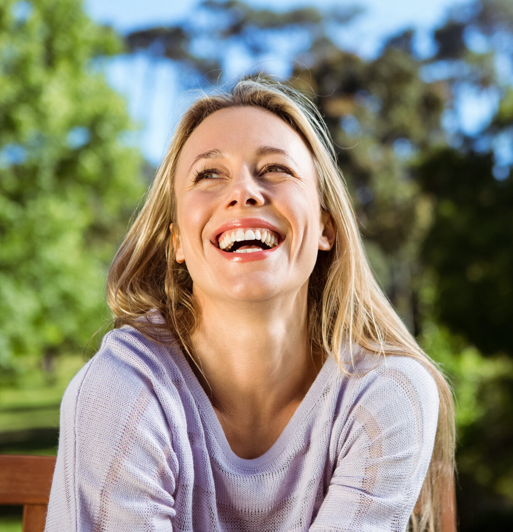 Pretty blonde relaxing in the park