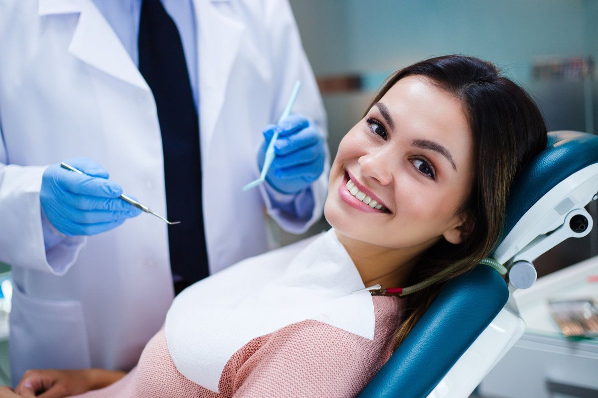 Smiling woman on dental chair