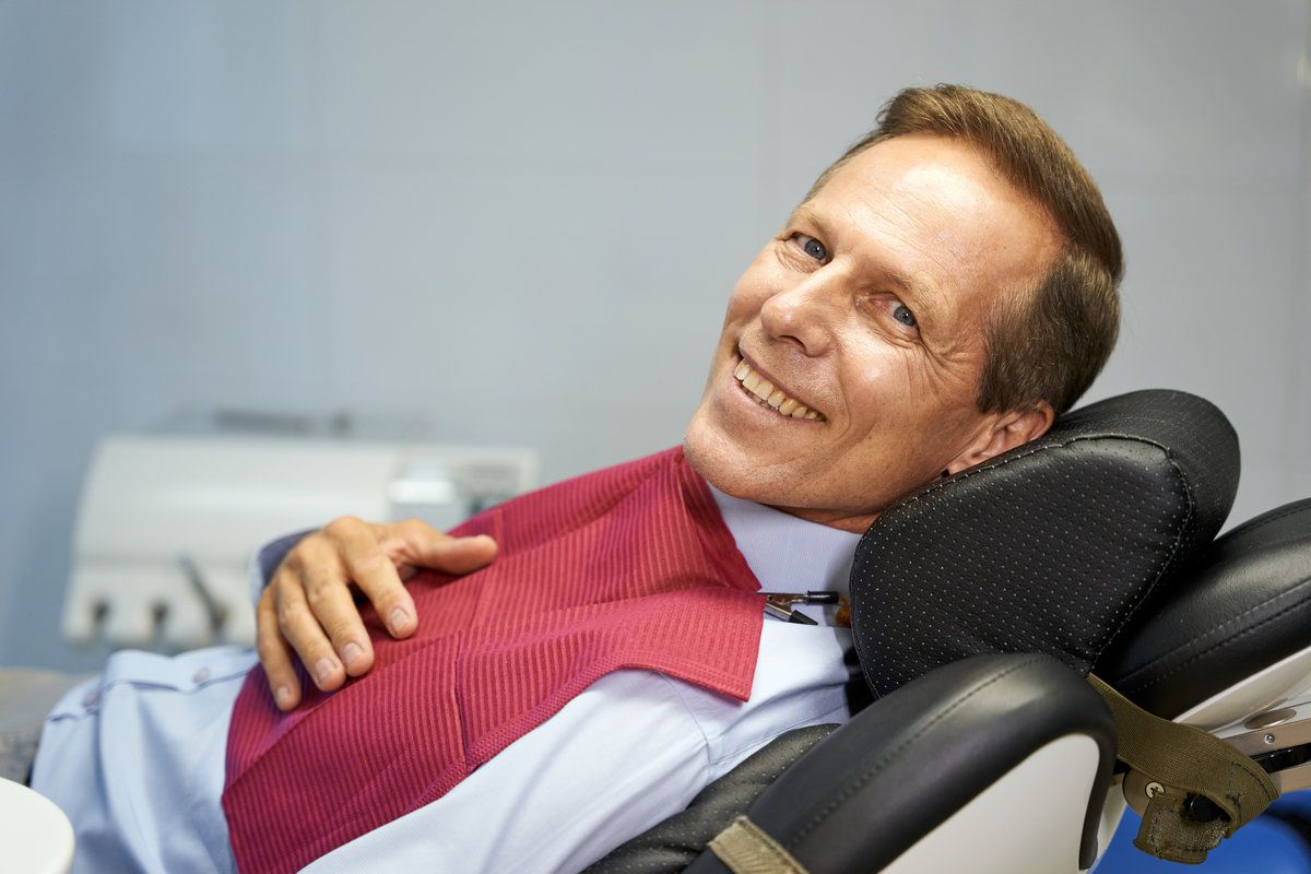 Man sitting on a dental chair