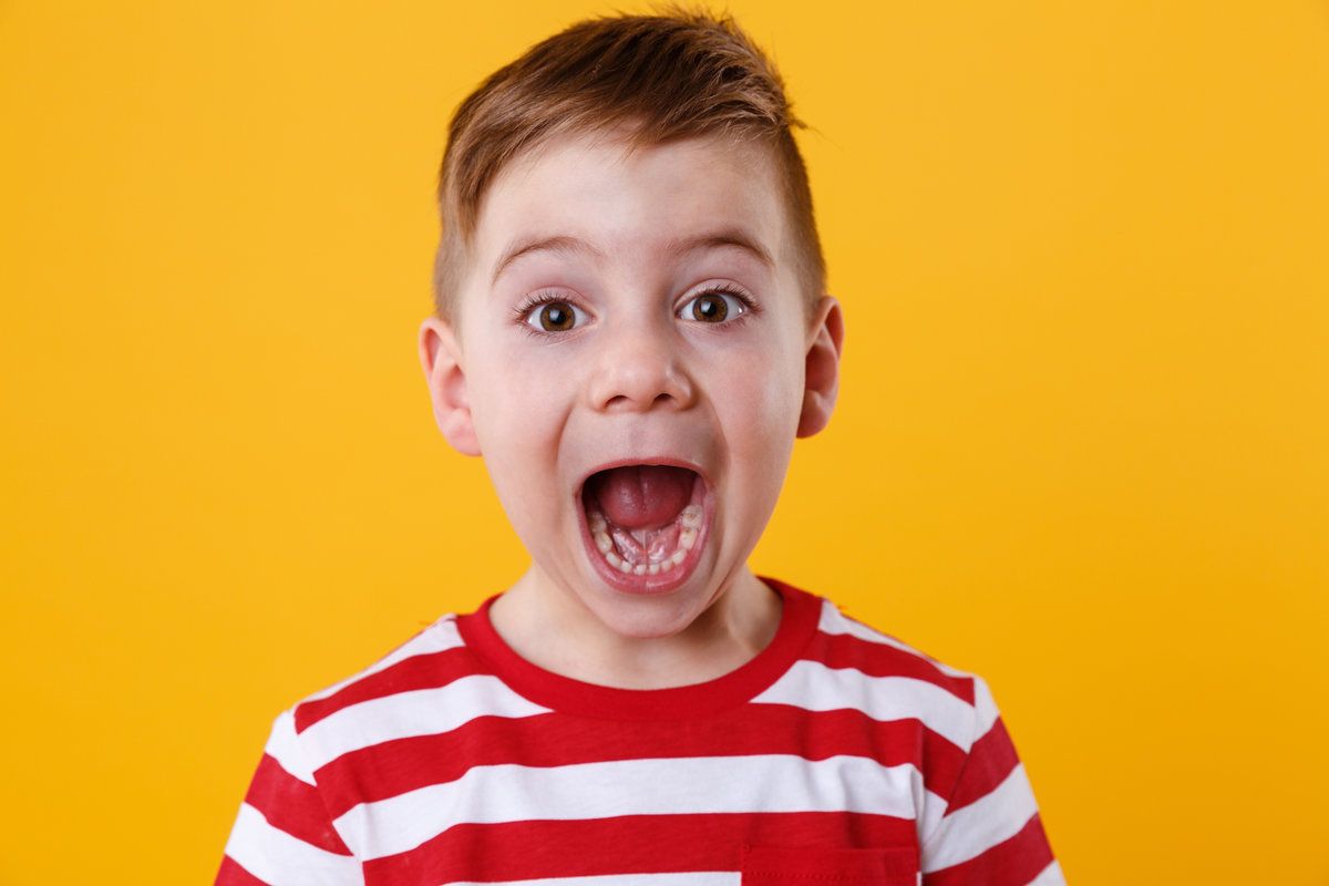 Excited boy with striped shirt