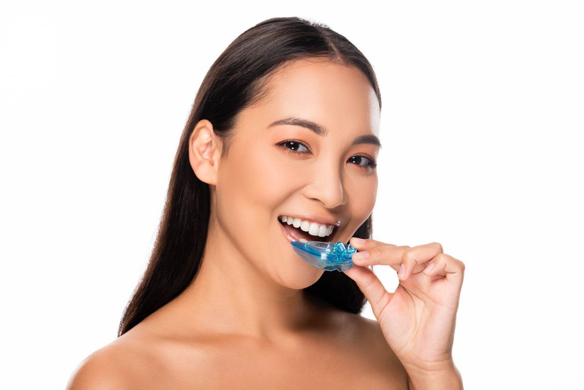 Woman smiling with dental mouthguard